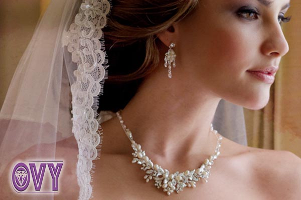 a bride wearing pearl necklace earrings set